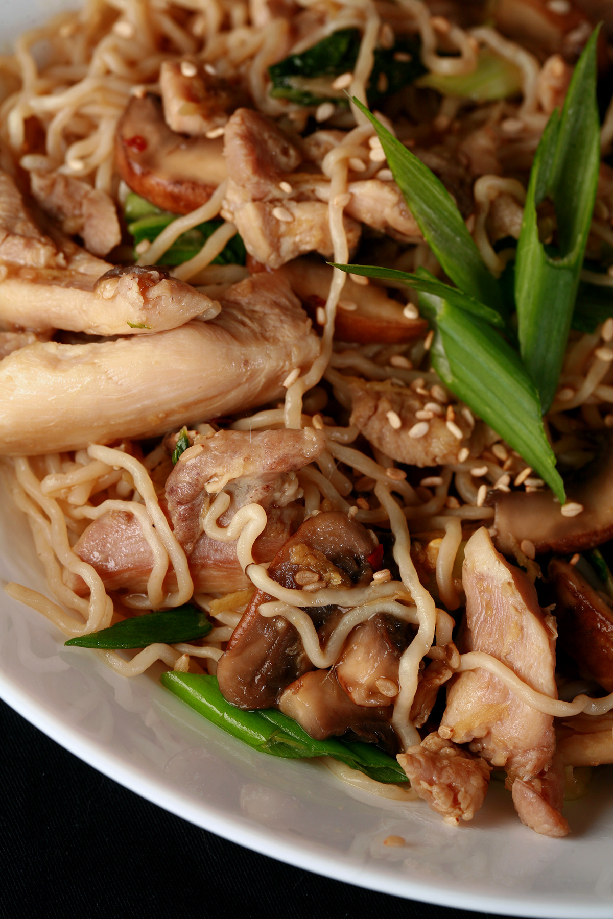 A close up view of a white bowl of low carb Shanghai noodles.