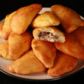 A plate piled high with low carb mushroom turnovers.