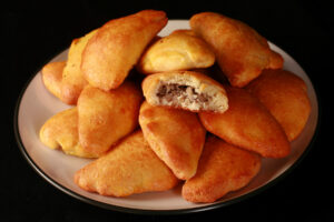 A plate piled high with low carb mushroom turnovers.