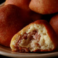 A close up view of a plate of keto sauerkraut buns - piroshky.