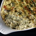 2 oval ramekins of hot low carb spinach dip.