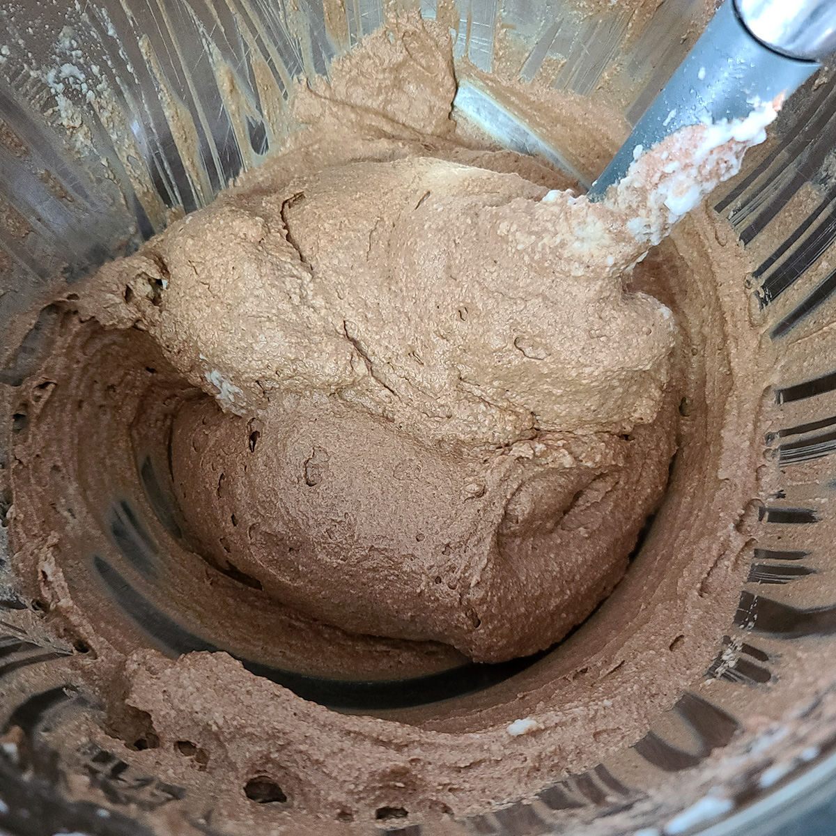 Keto chocolate mousse in a large mixing bowl, ready to put in glasses.