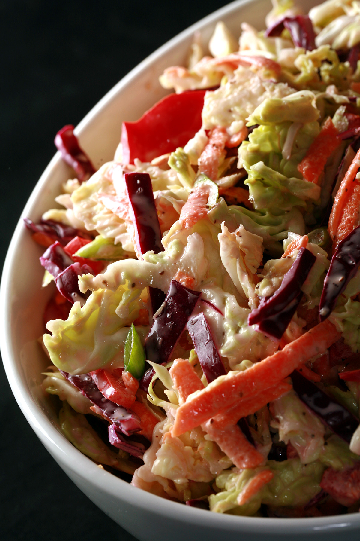 A bowl of colorful low carb coleslaw.