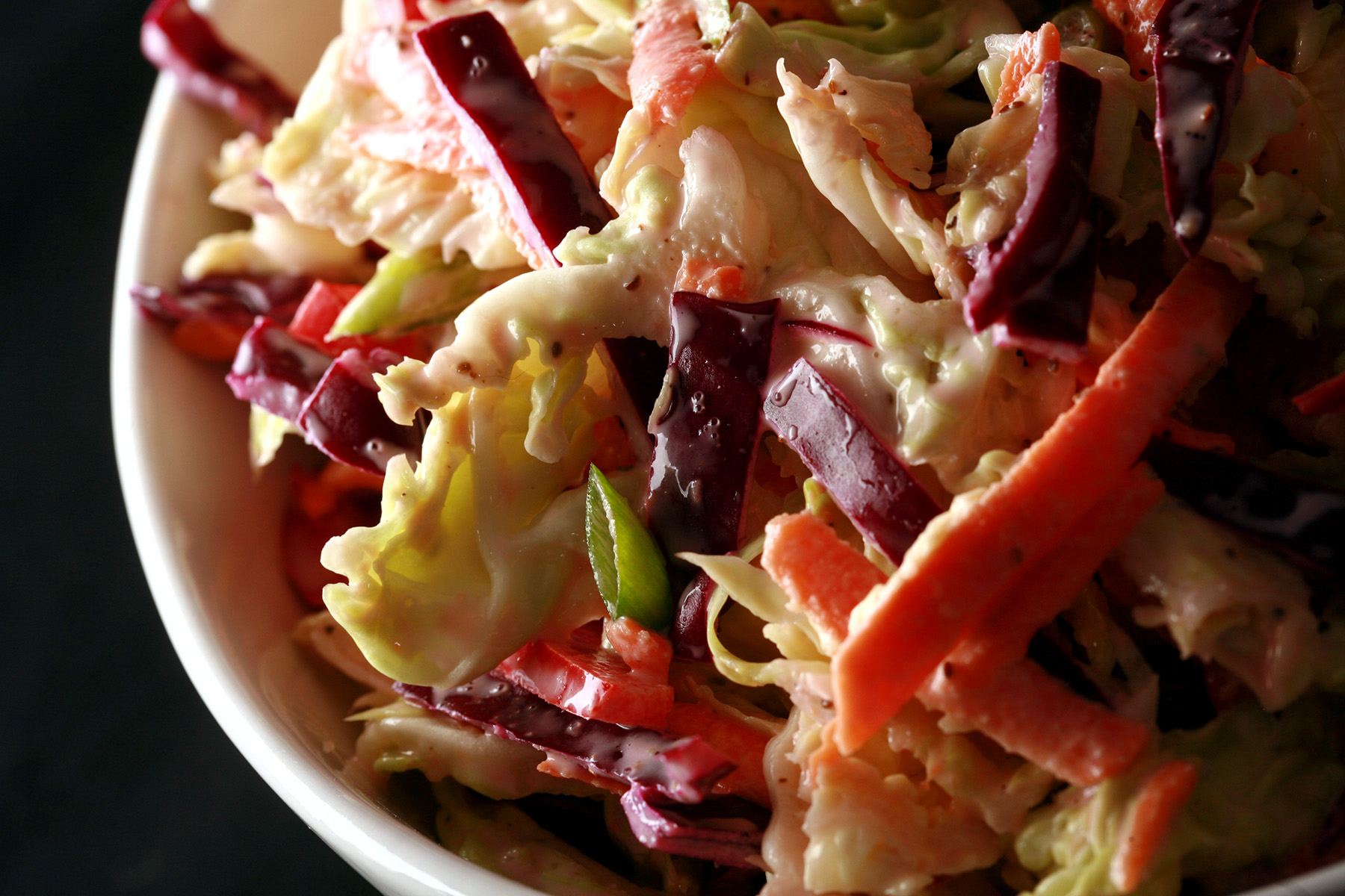 A bowl of colorful keto coleslaw.