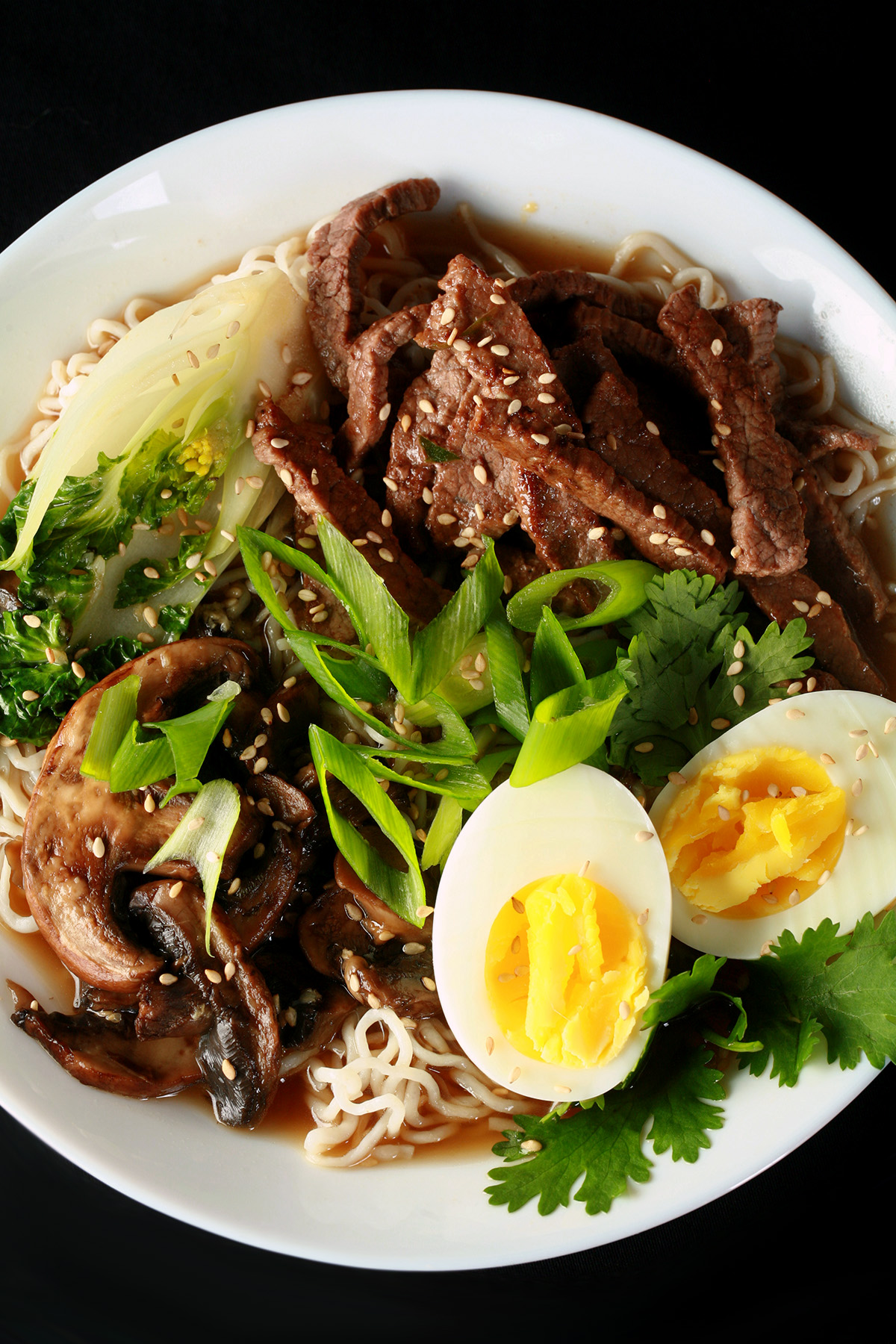 A bowl of low-carb ramen noodles, with baby bok choy, eggs, and more.