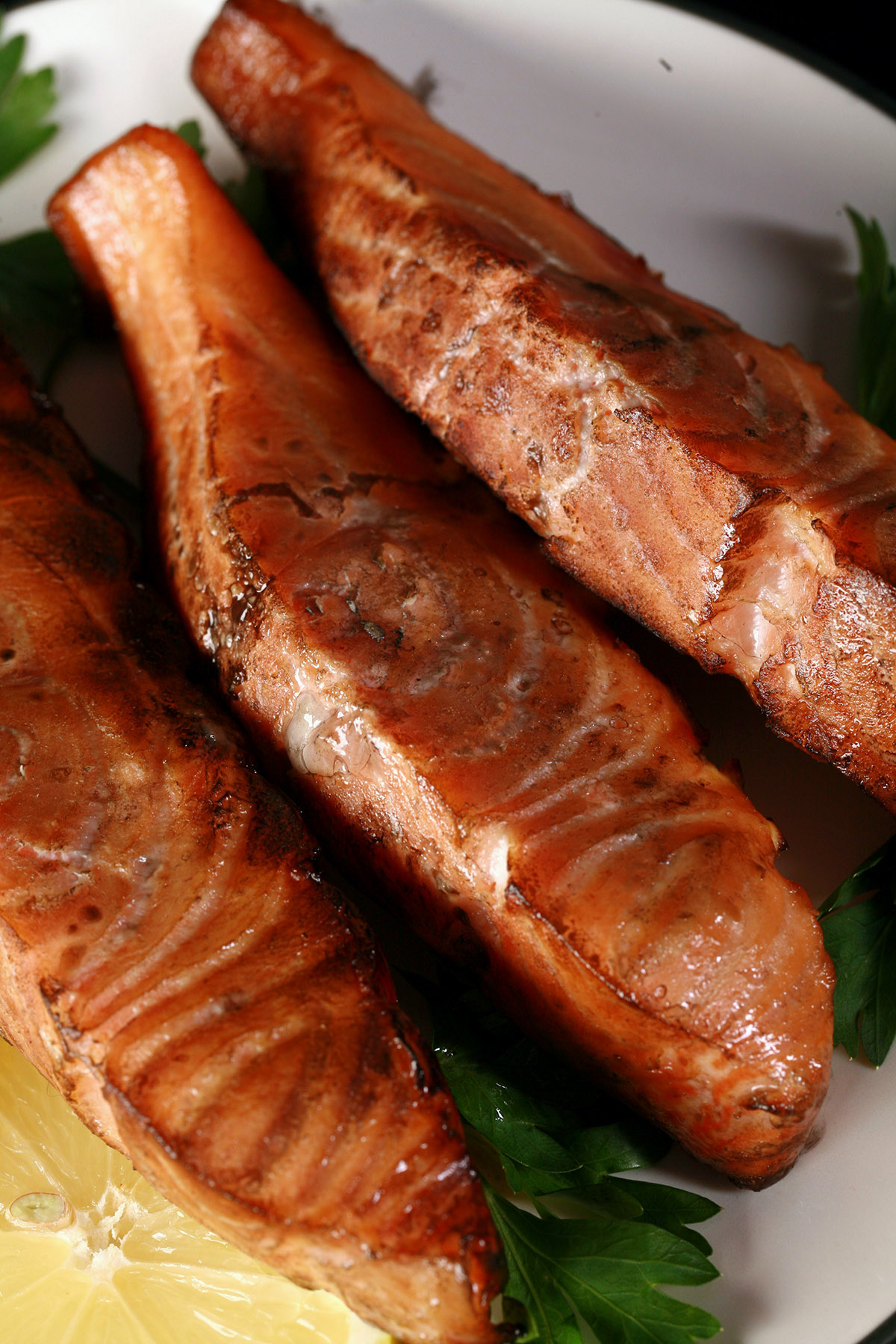 Several servings of hot smoked salmon on a plate.