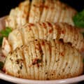 3 hasselback turnips on a plate.