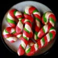 A plate of keto candy cane shaped cookies.
