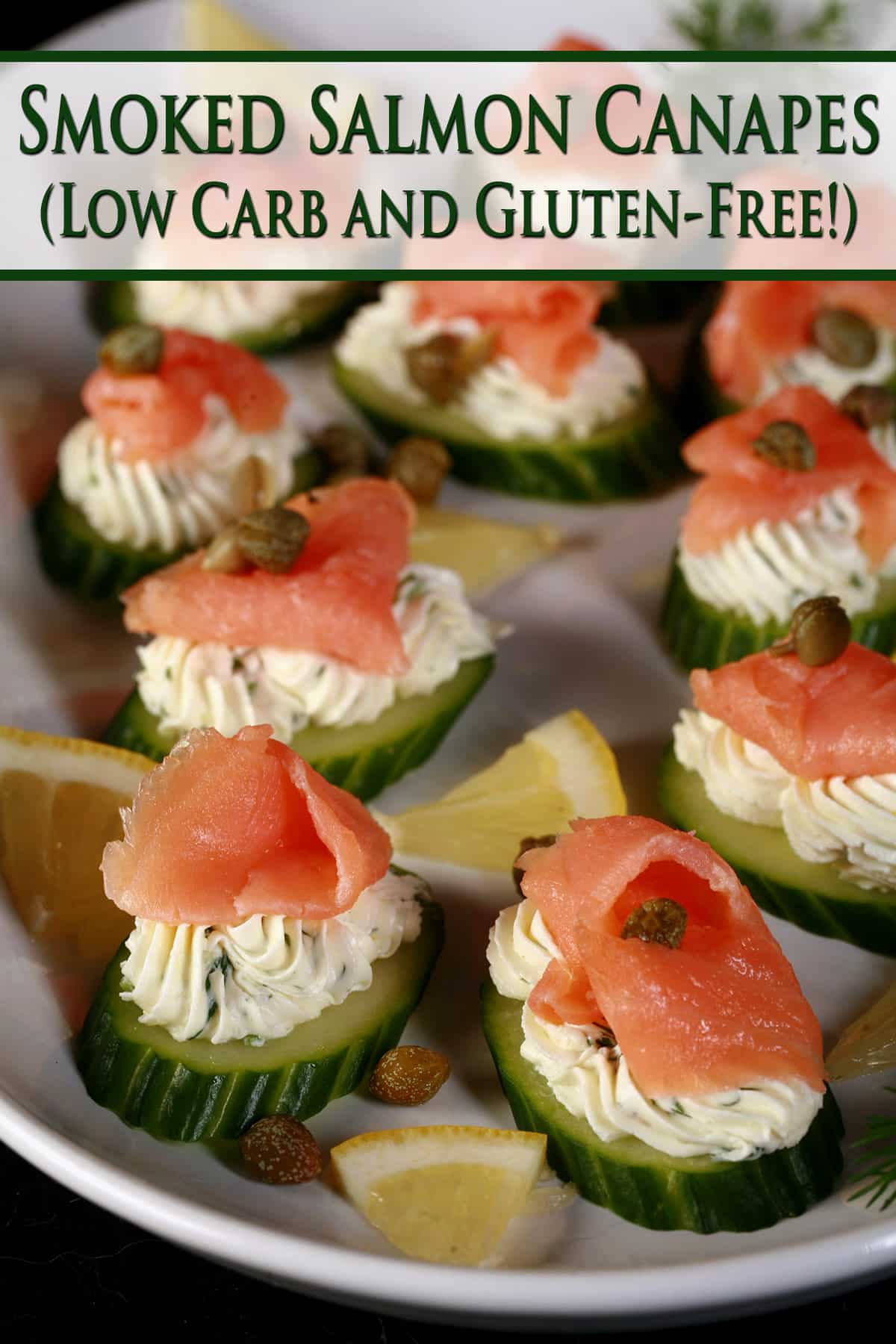 A plate of keto smoked salmon canapes with piped flavoured cream cheese on cucumber slices.