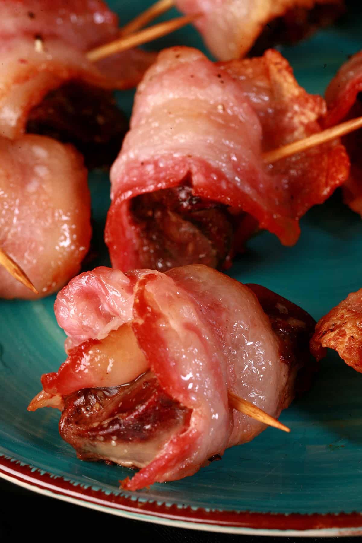 A plate of chicken livers wrapped in bacon.