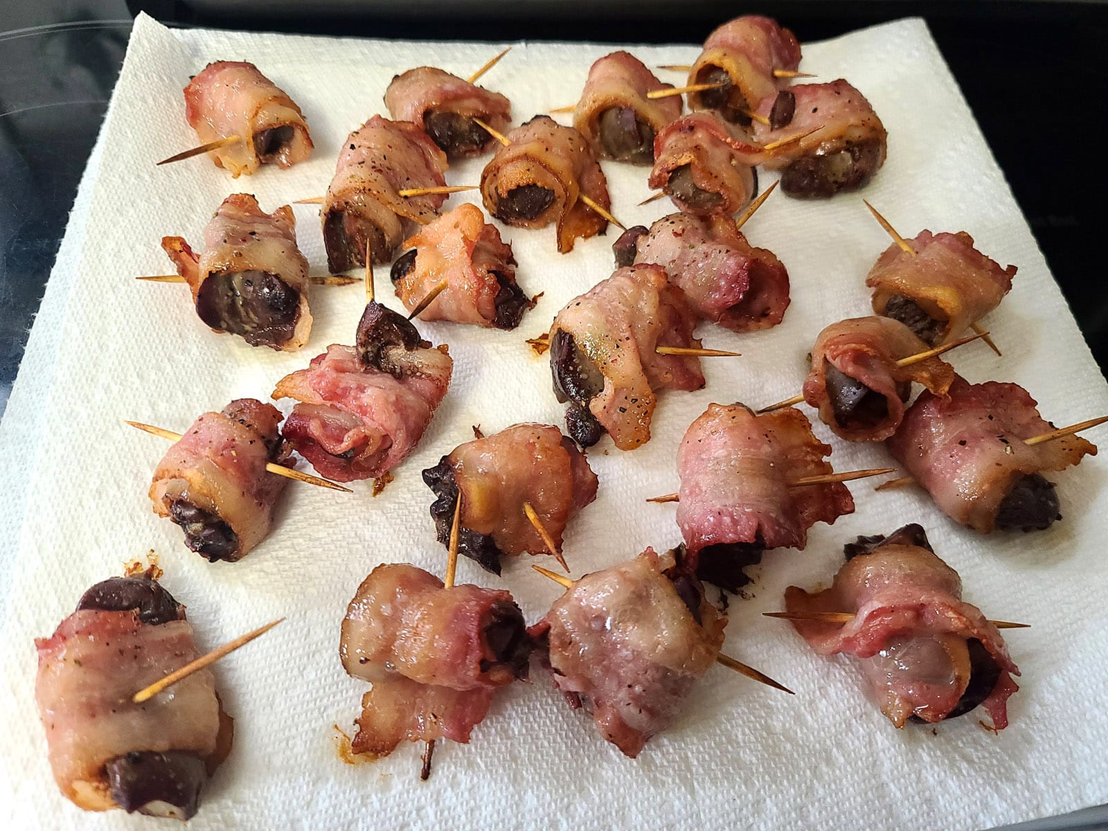 20 or so bacon wrapped chicken livers on paper towels.