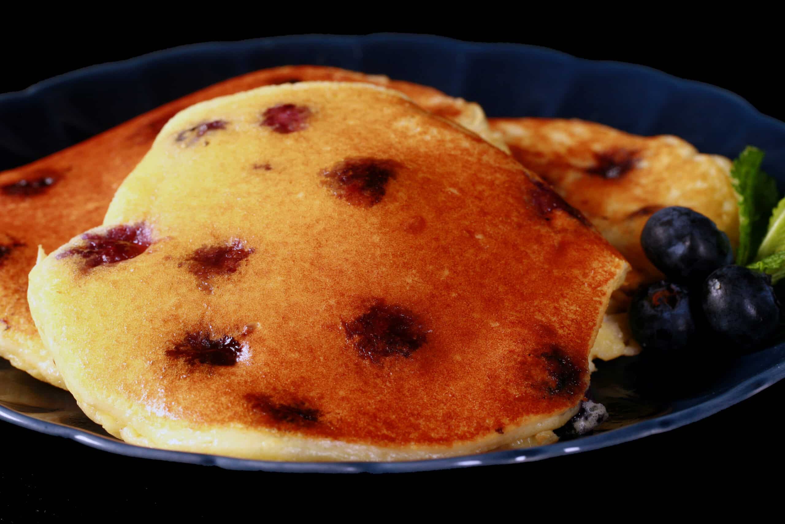 A plate of gluten free keto blueberry pancakes.