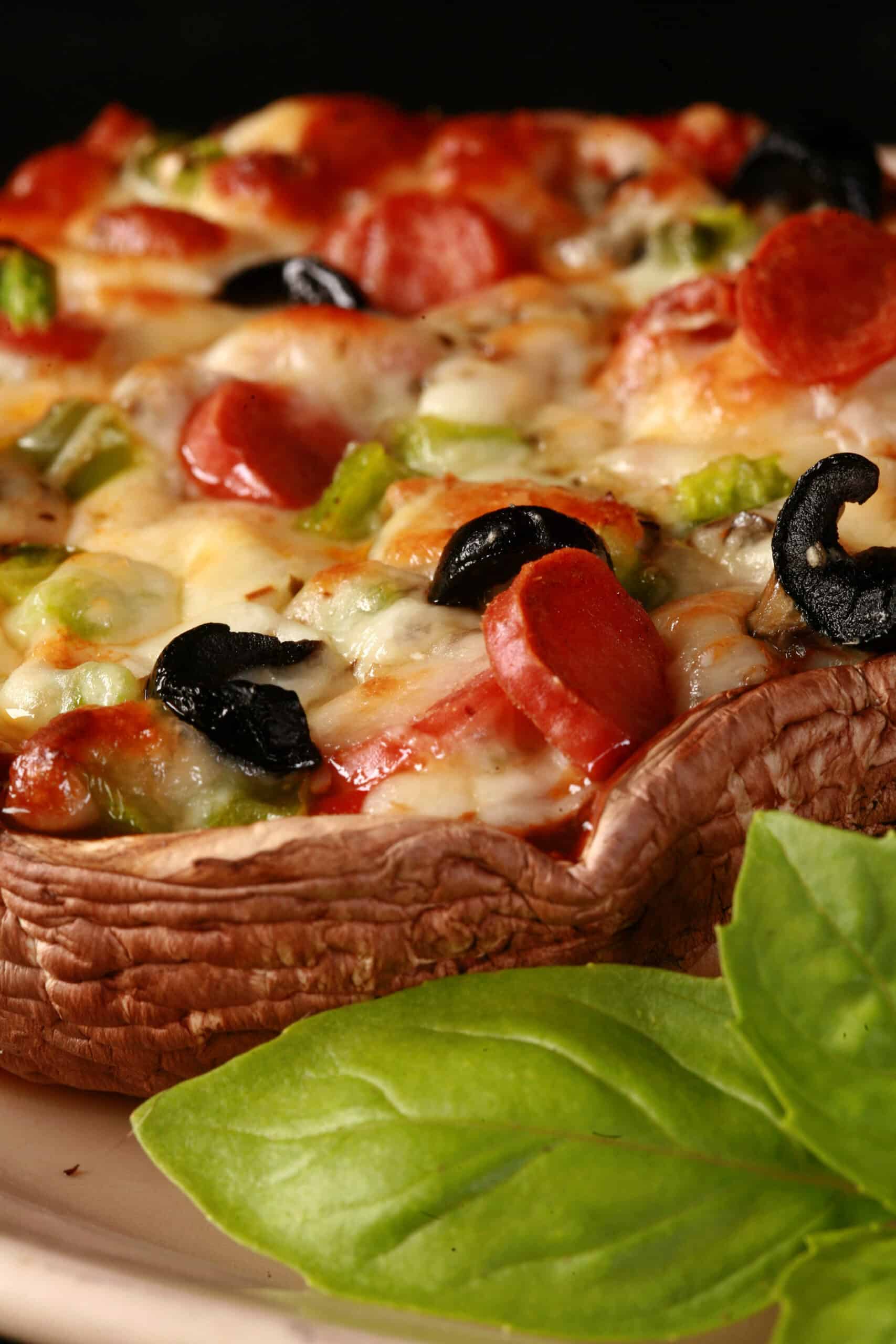 A close up photo of a deluxe portobello mushroom pizza.