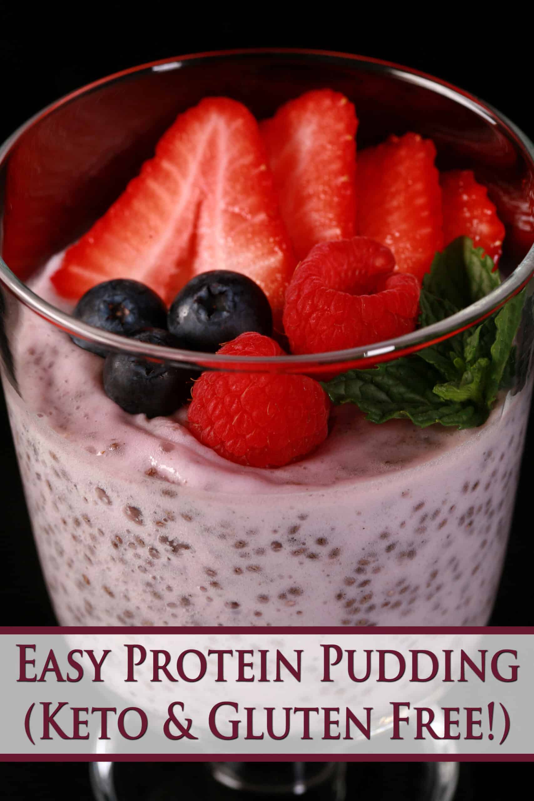A glass of pink pudding, topped with berries Red text says easy protein pudding keto and gluten free.