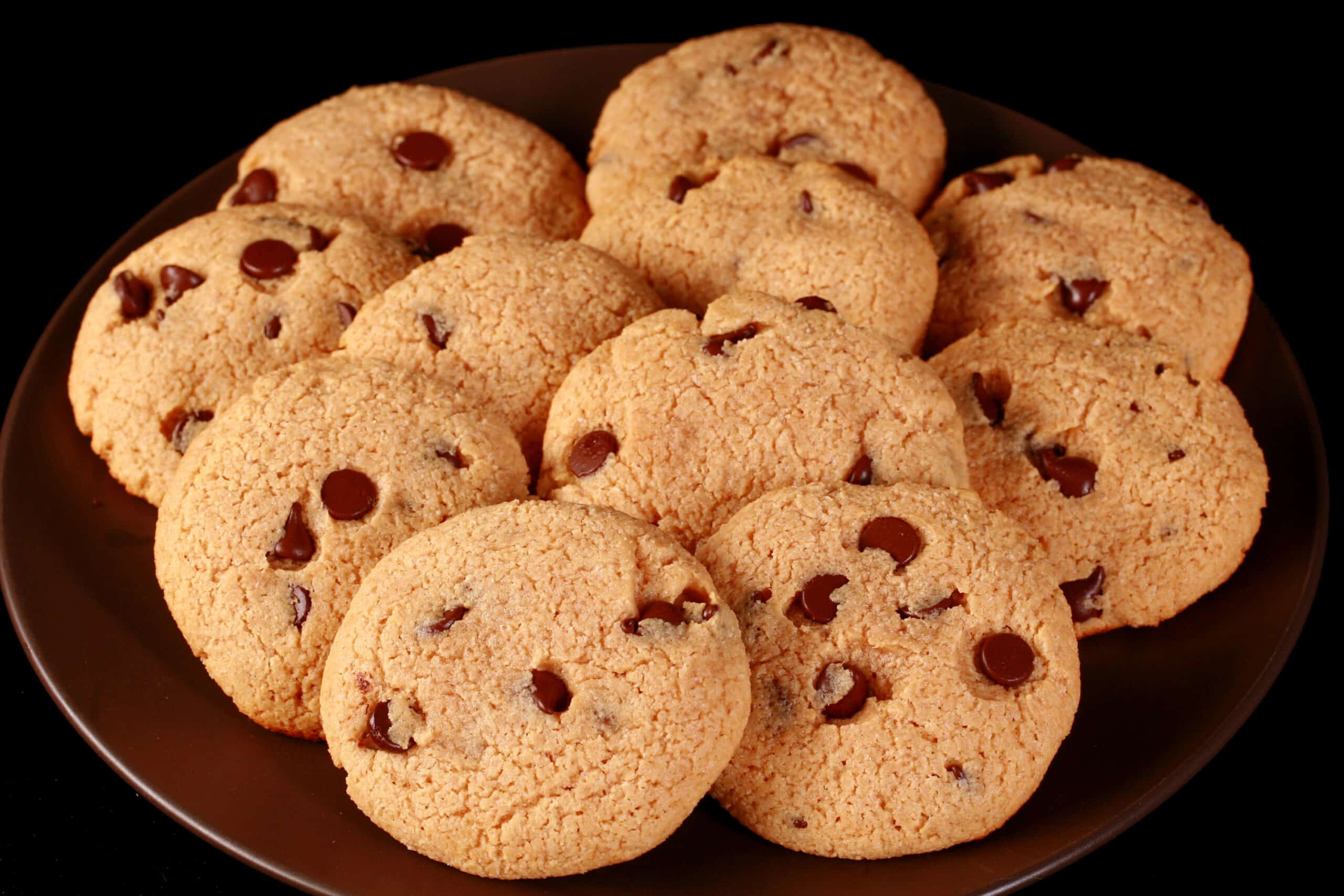 A plate of sugar free peanut butter chocolate chip cookies.