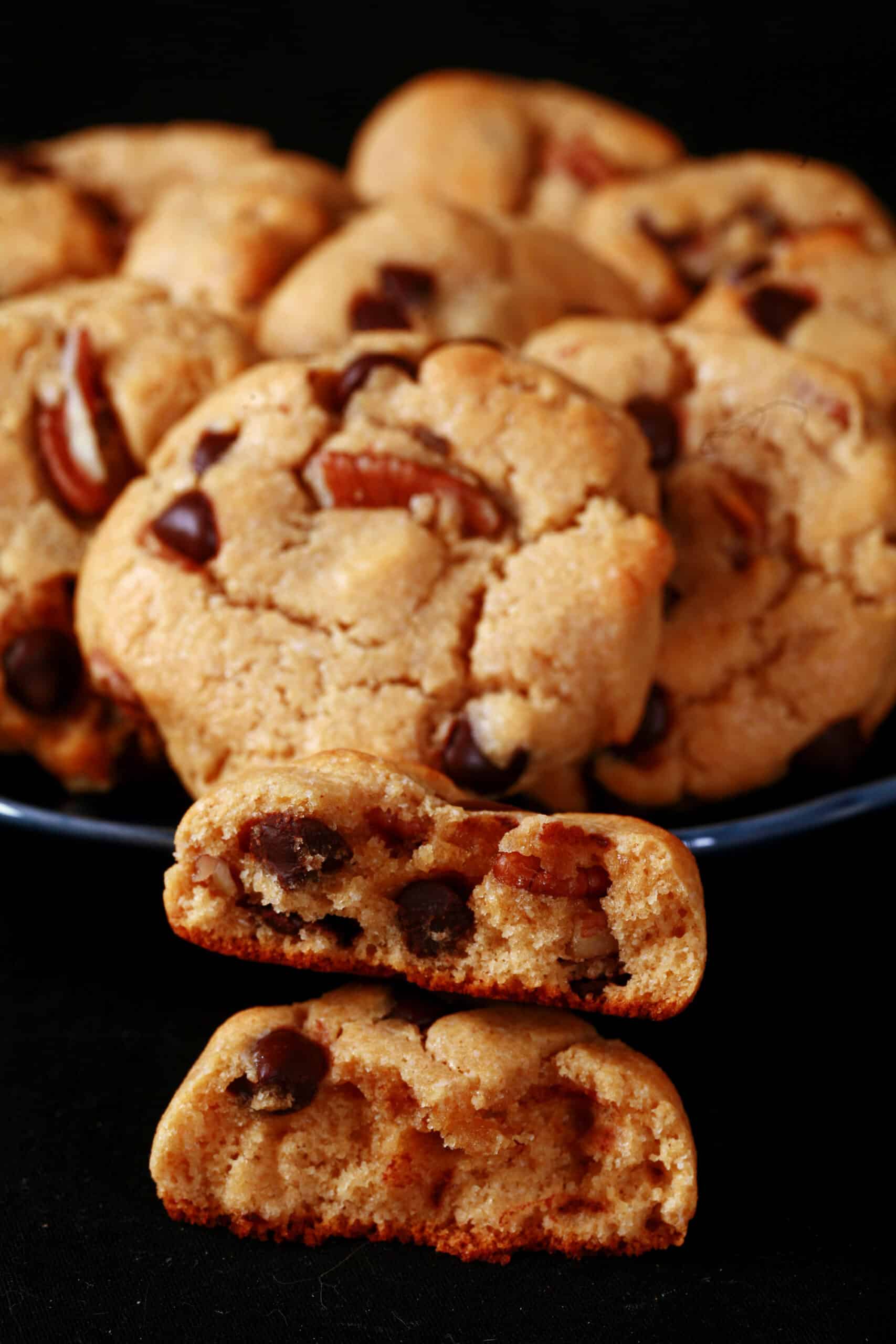 A plate of keto peanut butter cookies with chocolate chips and pecans.