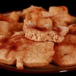 A plate of leaf shaped keto pumpkin spice sugar cookies.