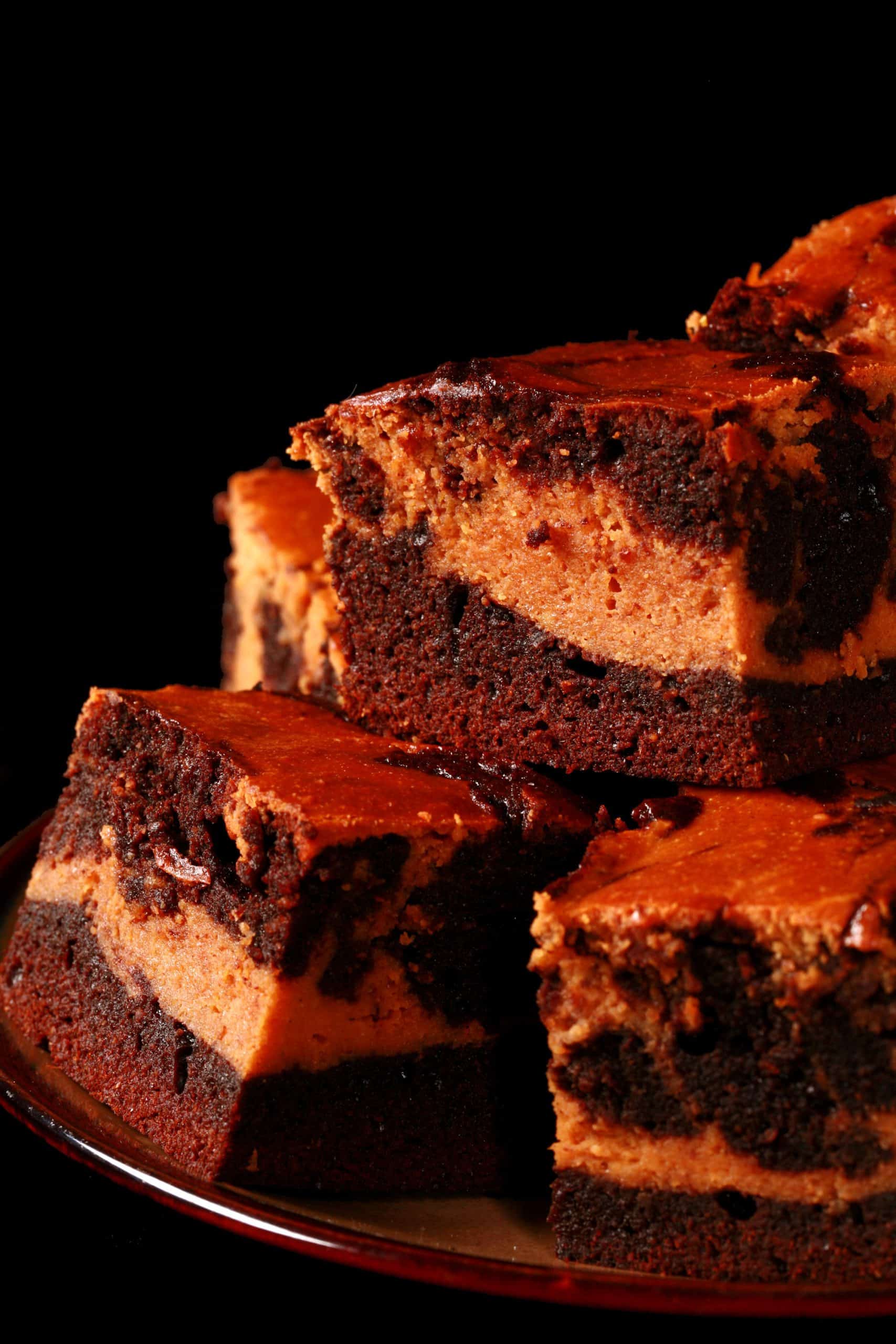 A plate of swirled low carb pumpkin cheesecake brownies.