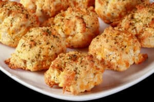 A plate of cheesy keto cheddar biscuits.