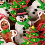 A plate of brightly decorated low carb gingerbread cookies in festive shapes.