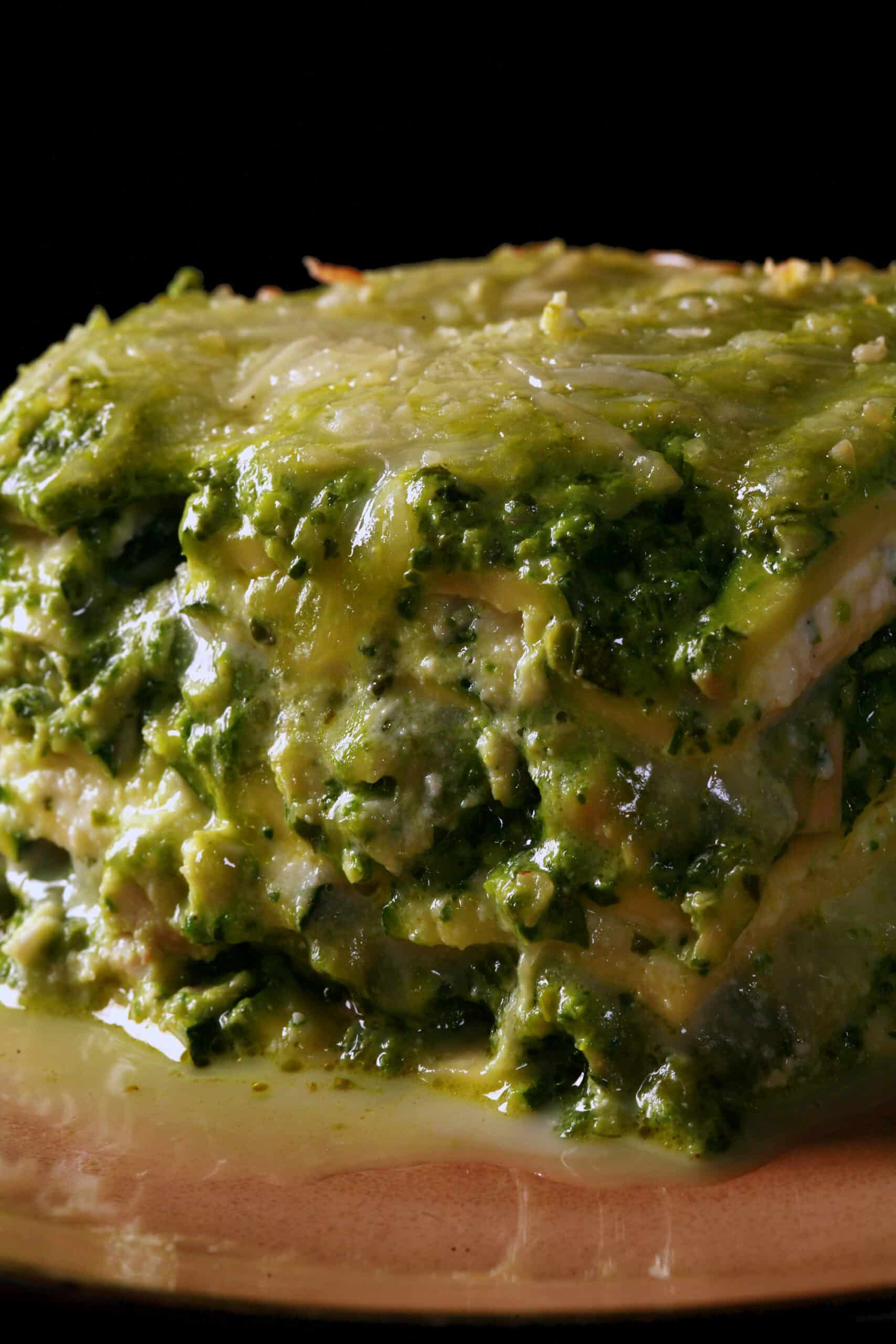 A close up photo of a serving of keto pesto chicken lasagna.