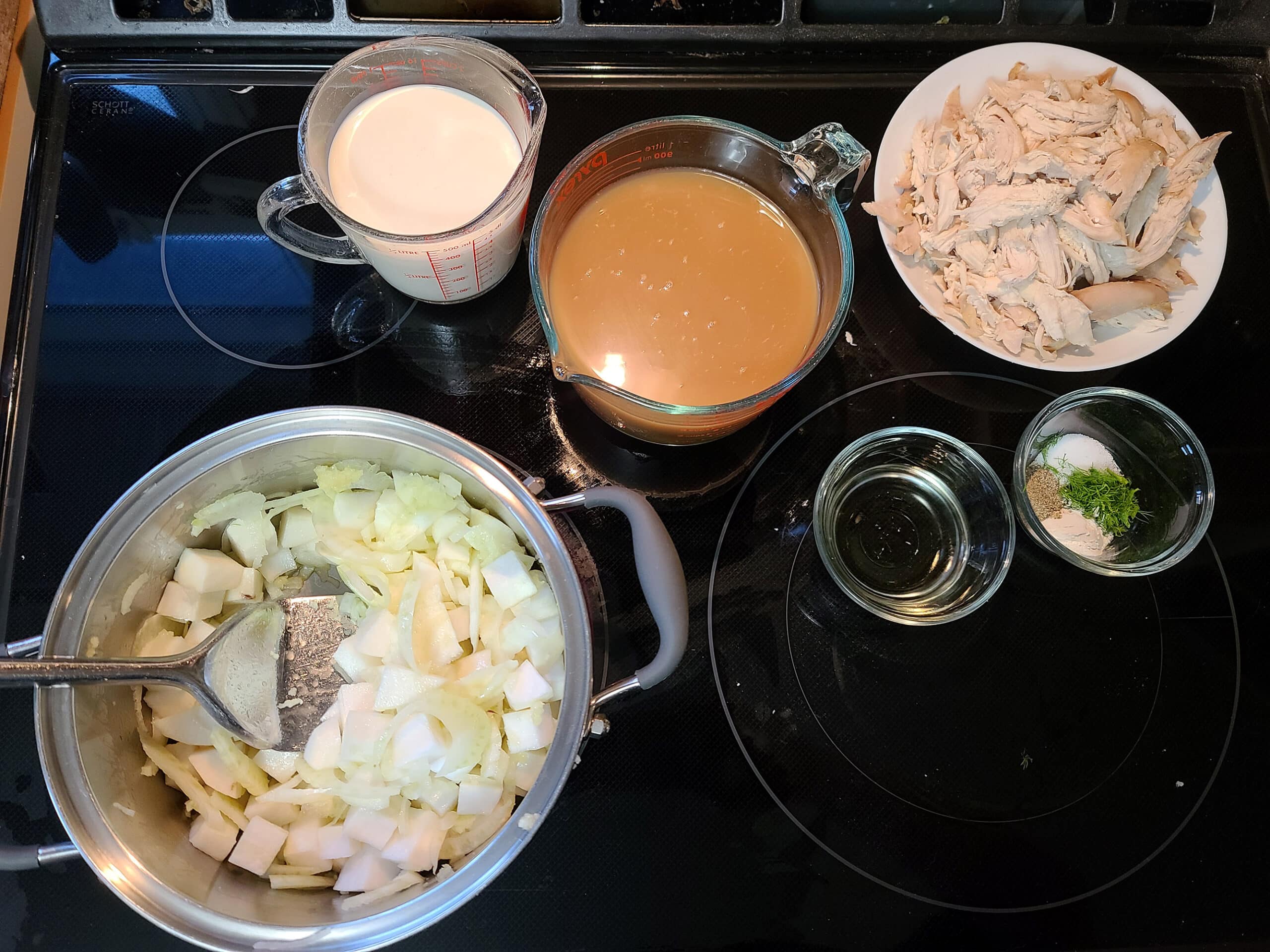 All of the soup ingredients laid out on the stove.