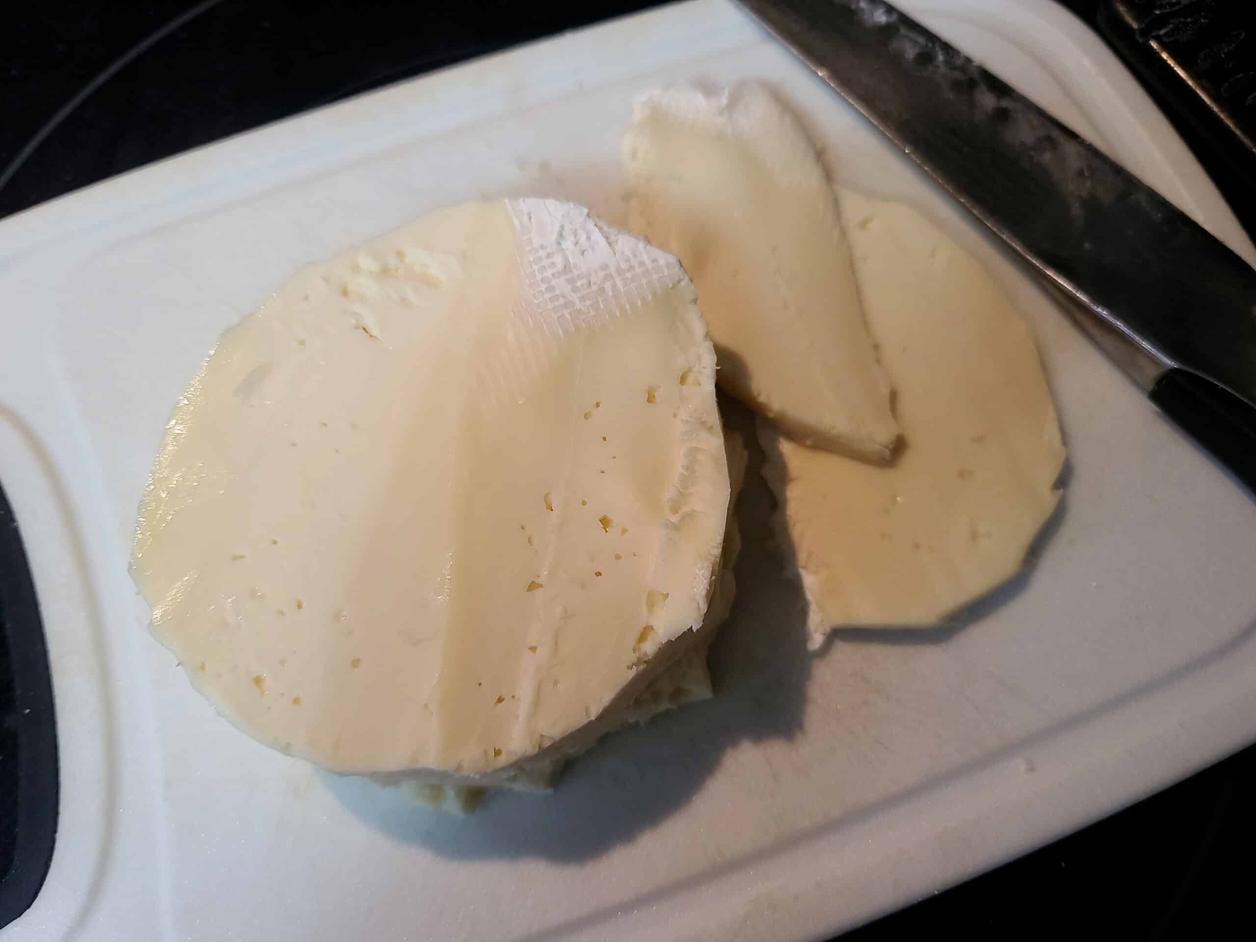 a small round of brie with the rind cut off.