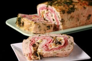 A close up view of a muffaletta meatloaf.