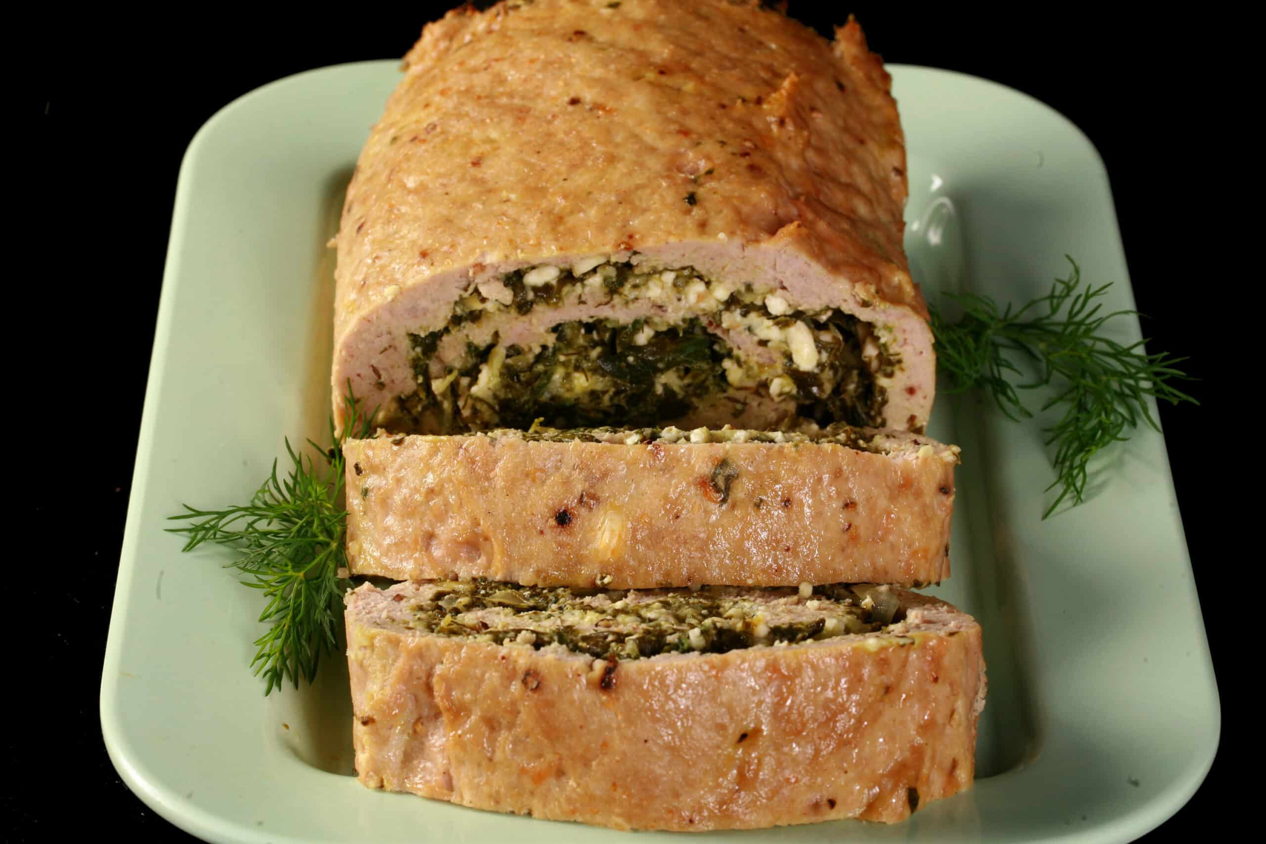 A rolled Spanakopita stuffed chicken meatloaf.