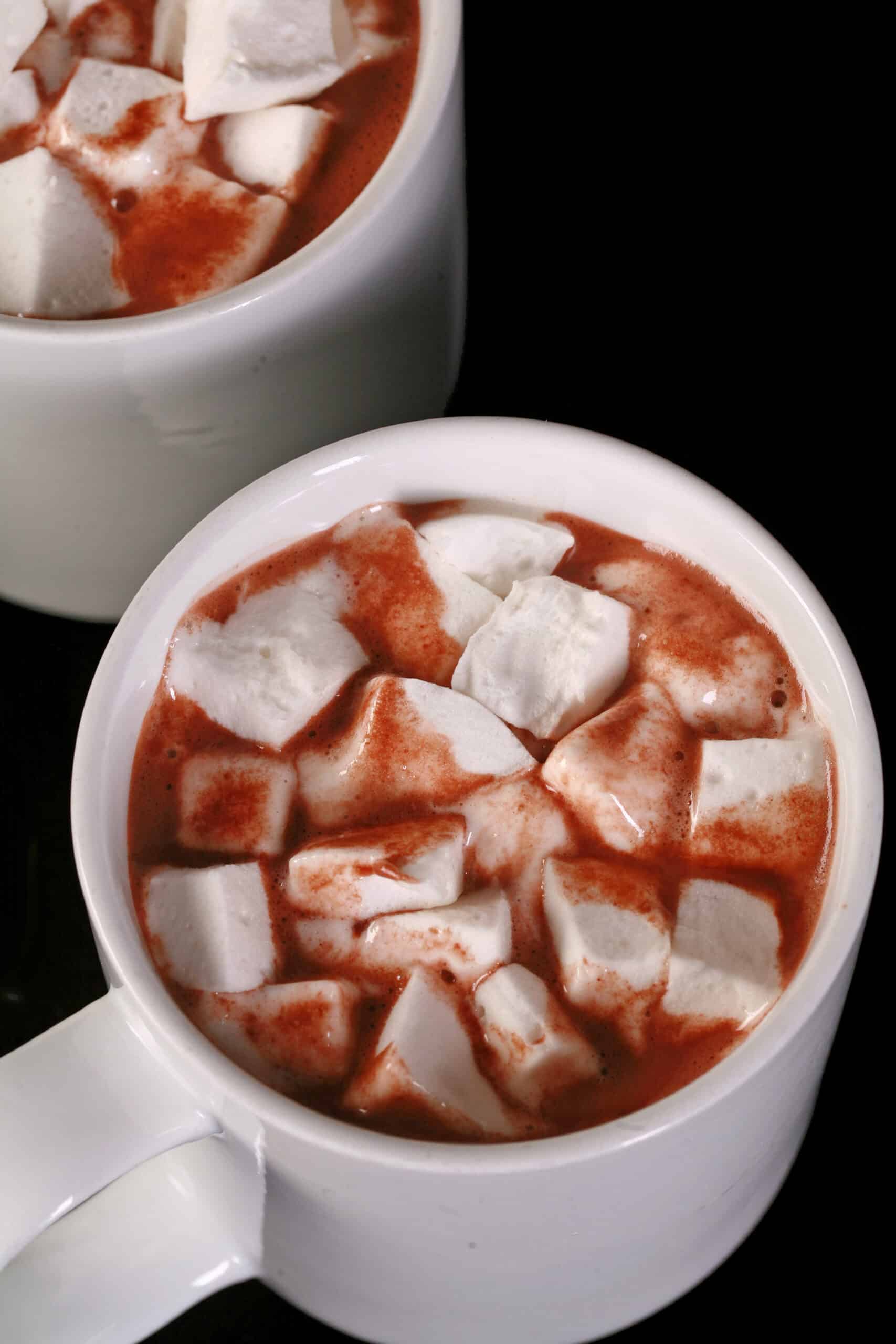 2 mugs of sugar free hot cocoa, topped with sugar free marshmallows.