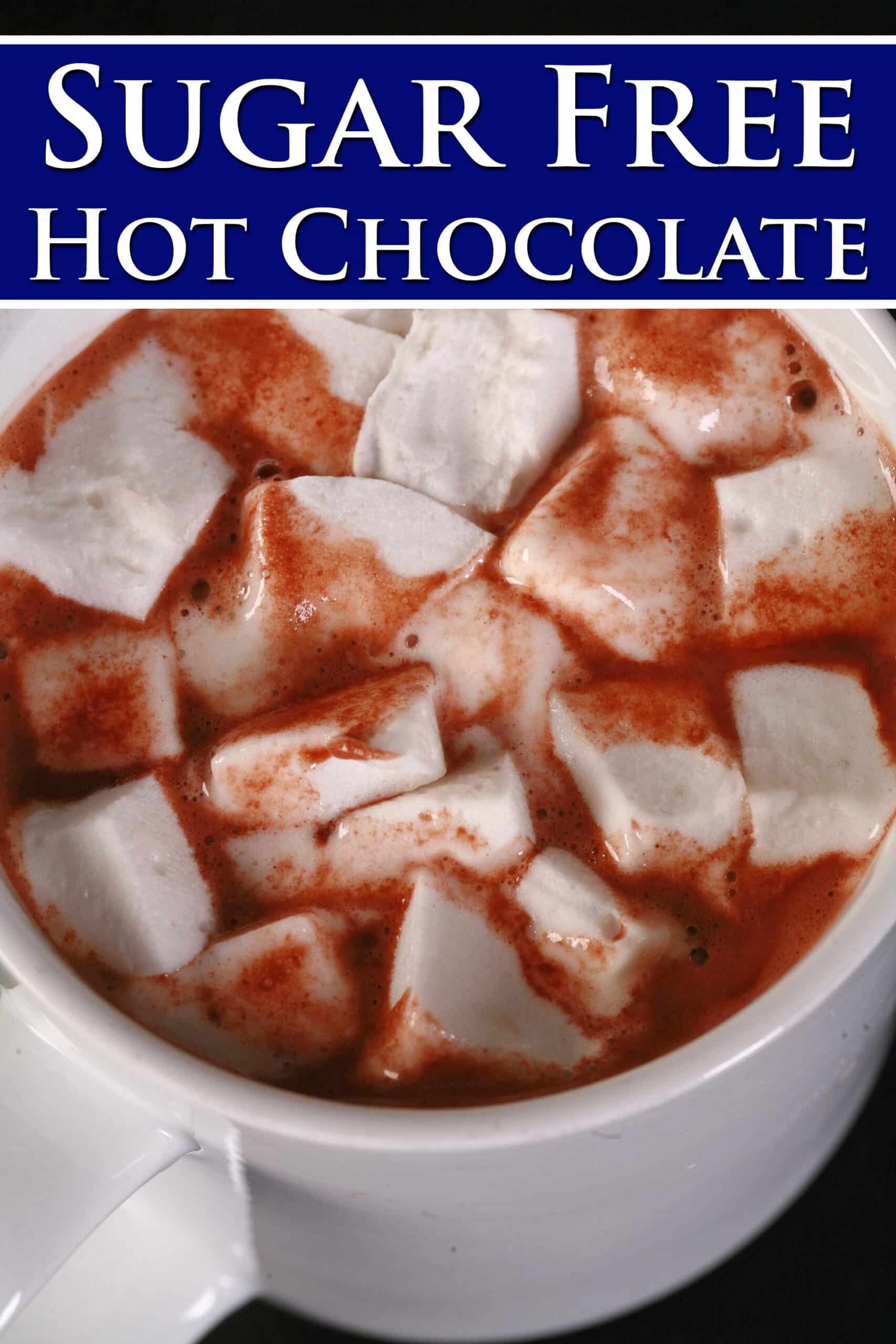 A mug of keto hot cocoa, topped with sugar free marshmallows. Overlaid text says sugar free hot chocolate.