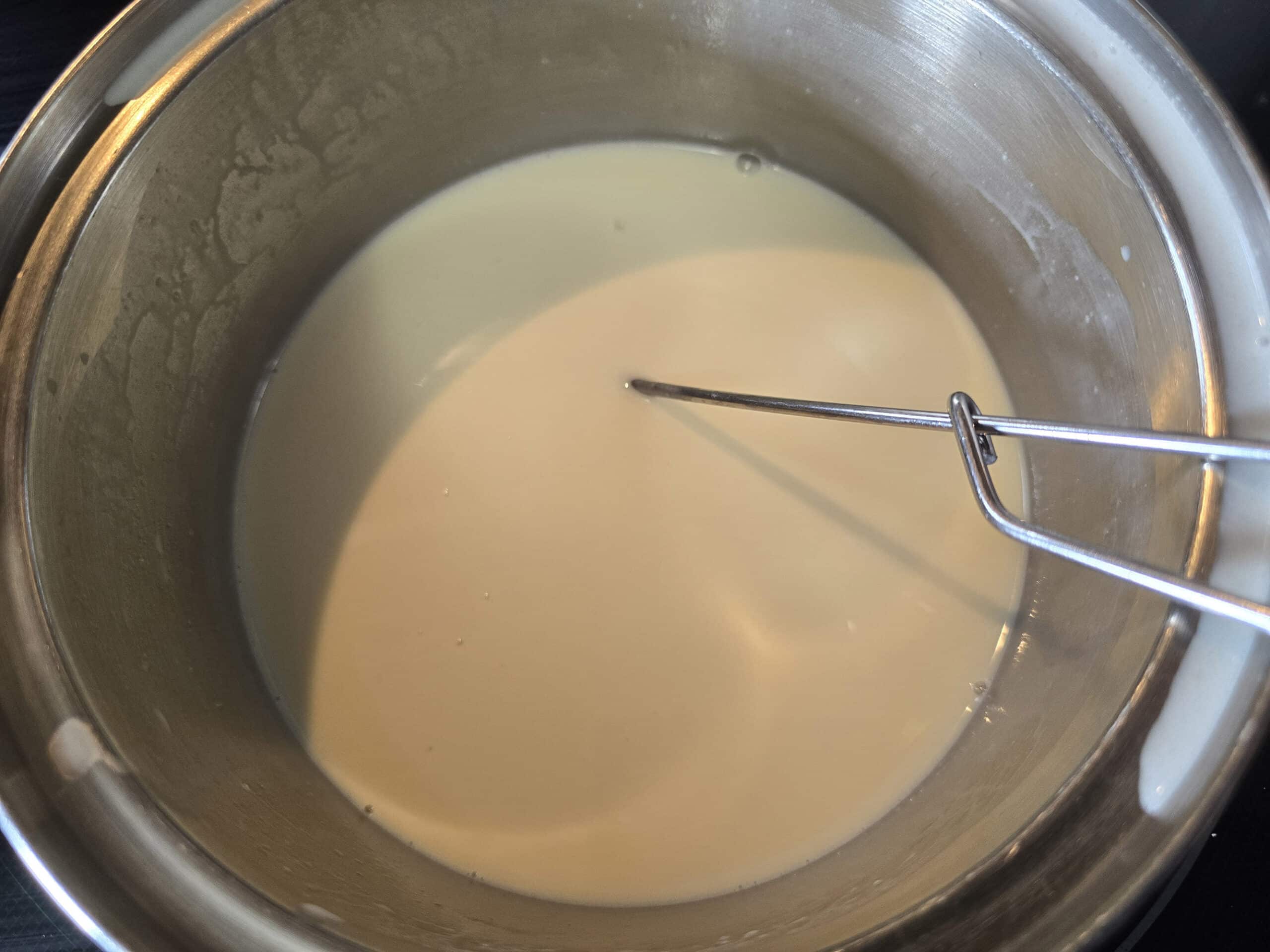 A pot of white hot chocolate, with the sugar free white hot chocolate chips completely melted in.