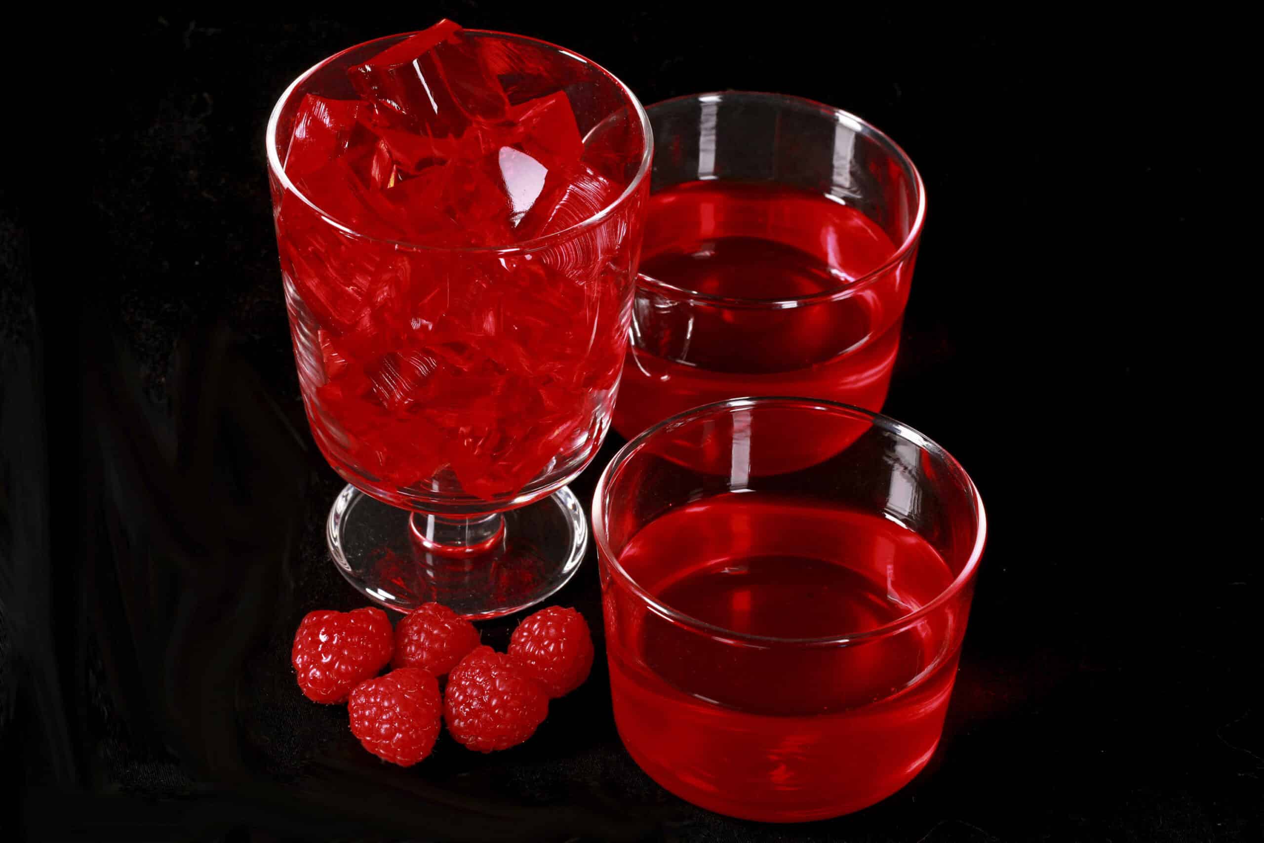 3 glasses of Raspberry homemade Sugar Free Jello with some fresh raspberries.