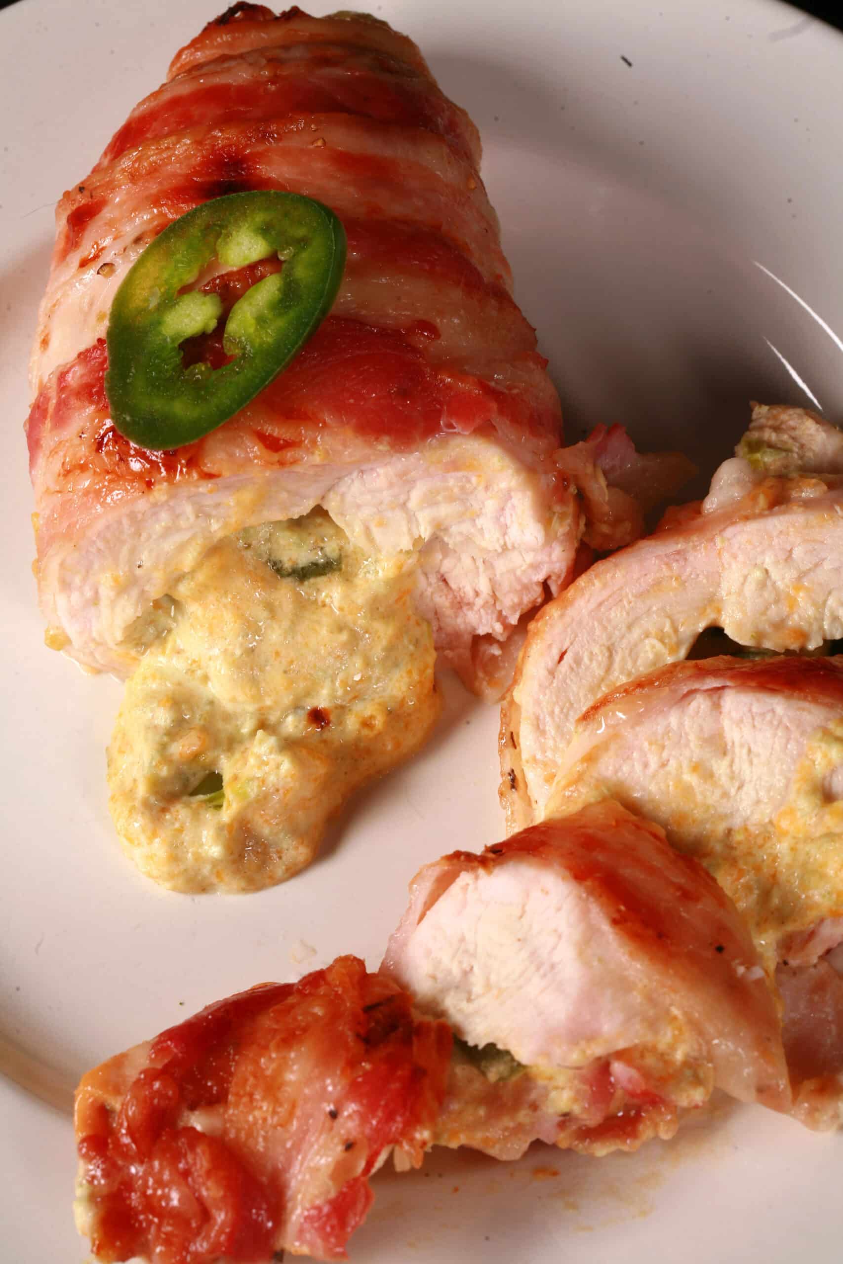 A plate of Jalapeno popper stuffed chicken breasts.