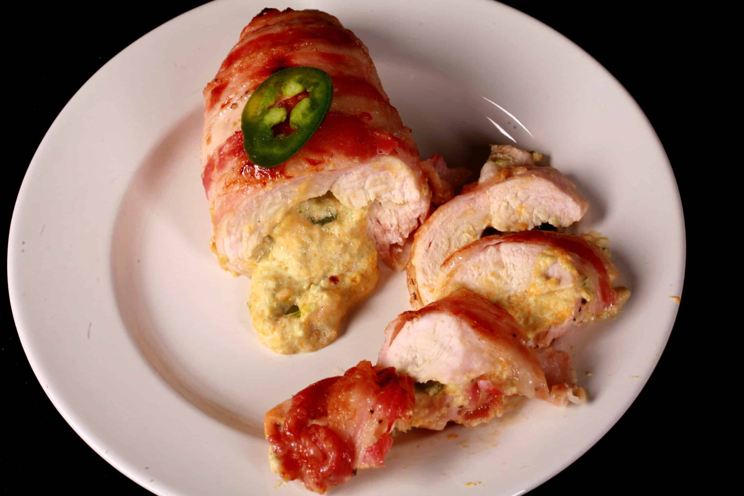 A plate of Jalapeno popper stuffed chicken breasts.