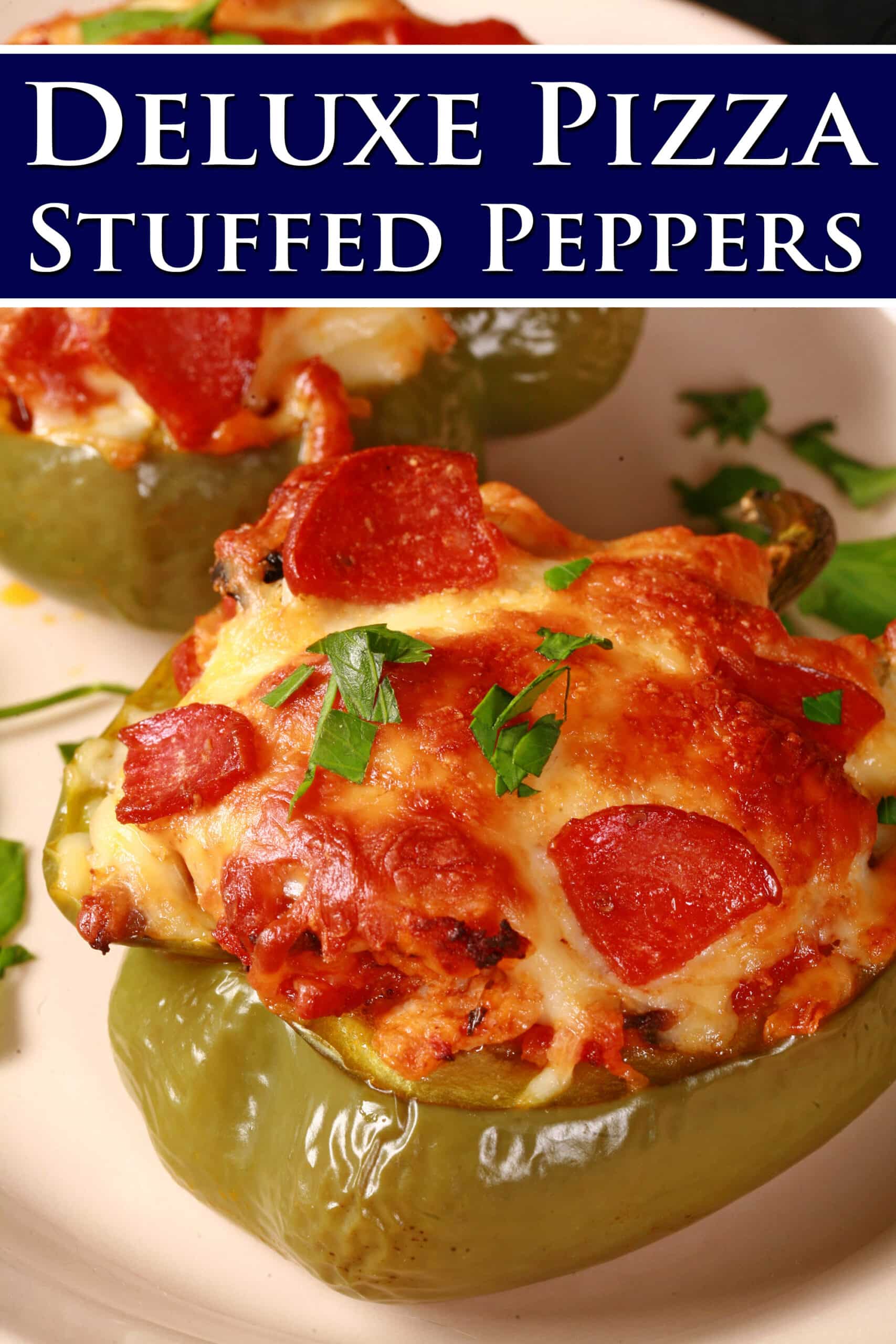 A plate of green peppers stuffed with pizza toppings. Overlaid text says deluxe pizza stuffed peppers.