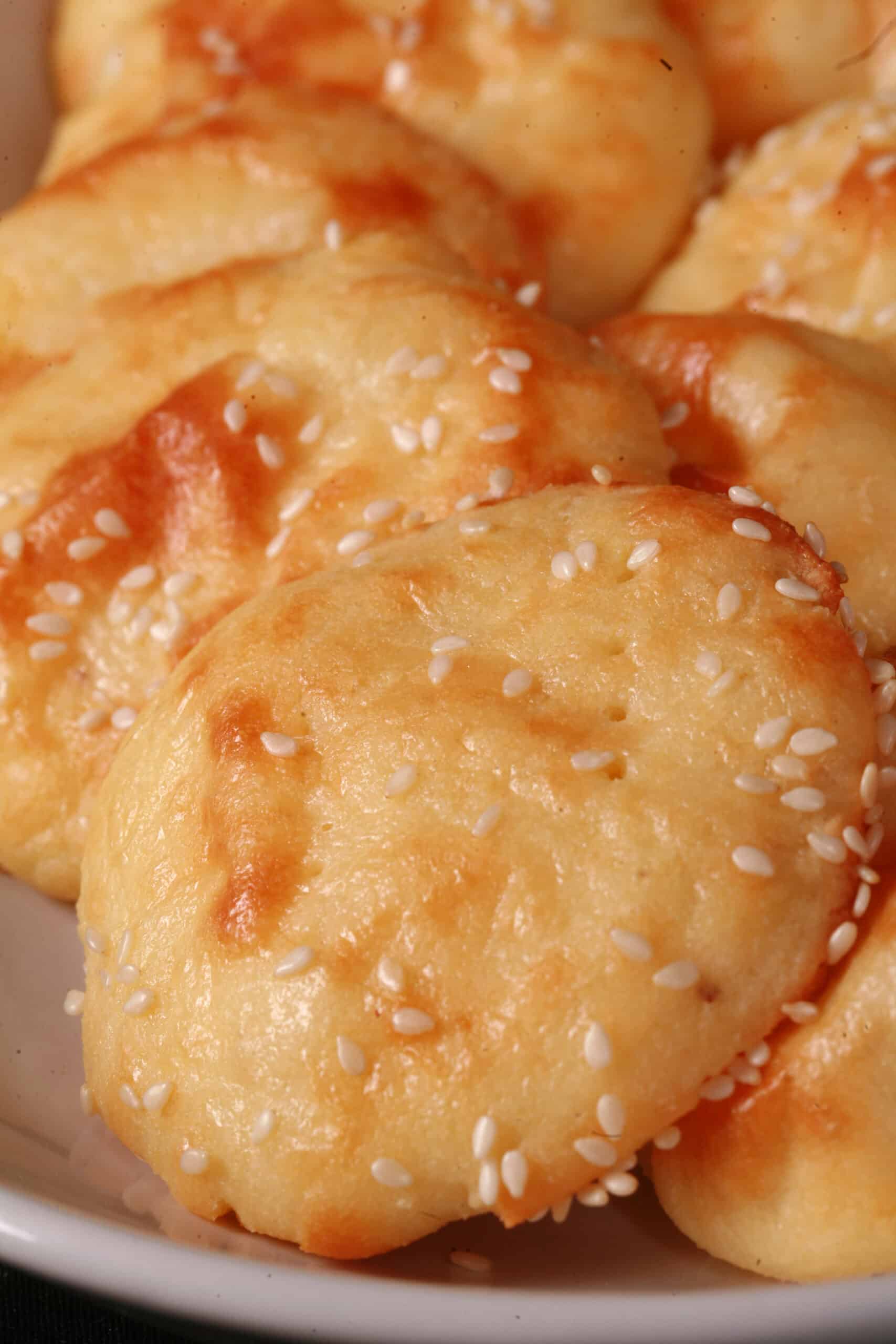 A plate of keto mini pita rounds with sesame seeds.