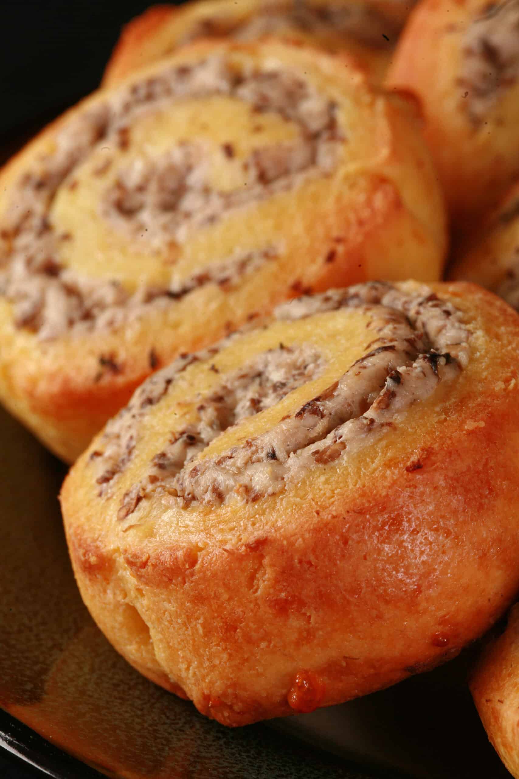 A plate of fathead pastry keto mushroom and cheese pinwheels.