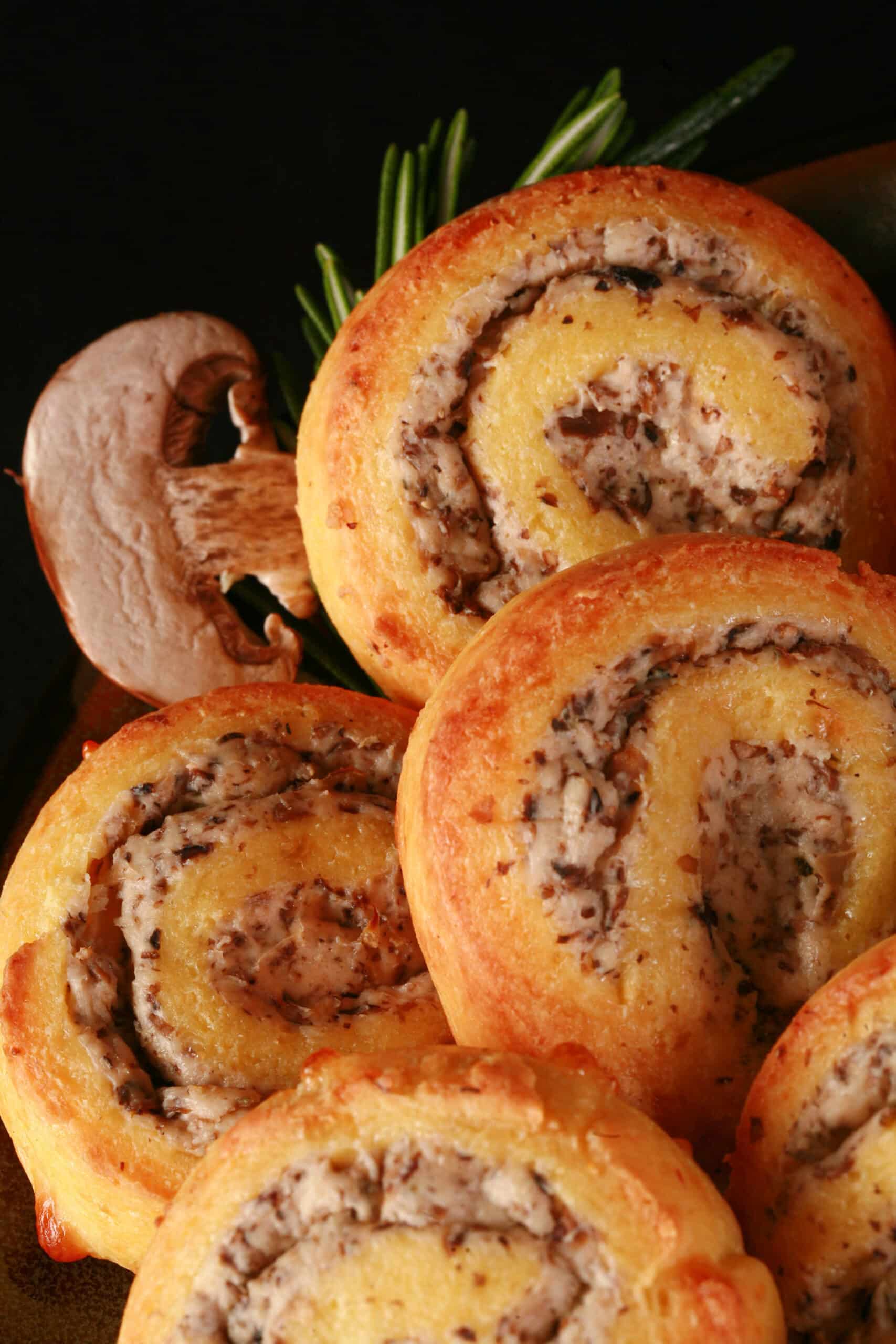 A plate of fathead pastry keto mushroom and cheese pinwheels.