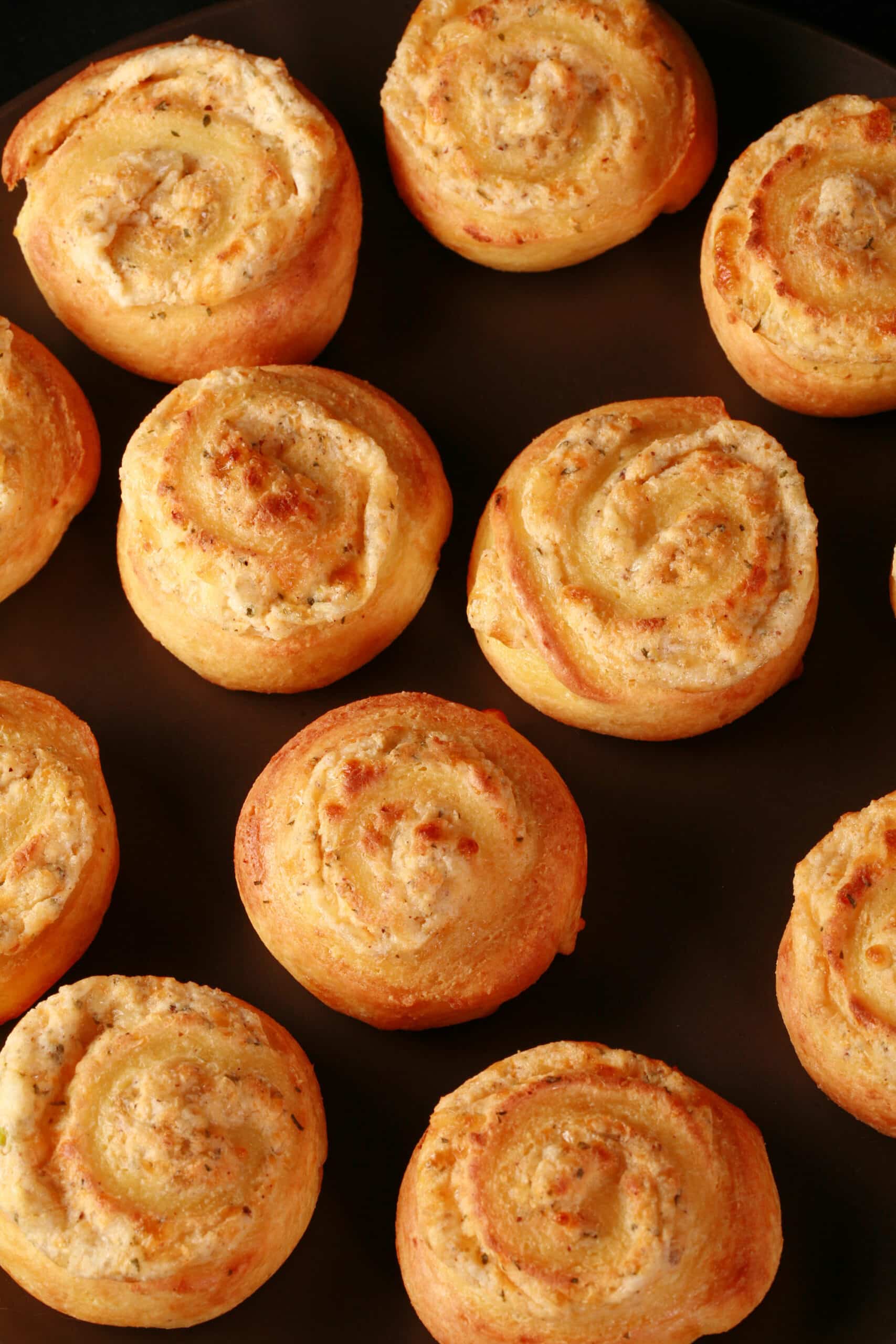 A plate of fathead pastry keto onion and cheese pinwheels.
