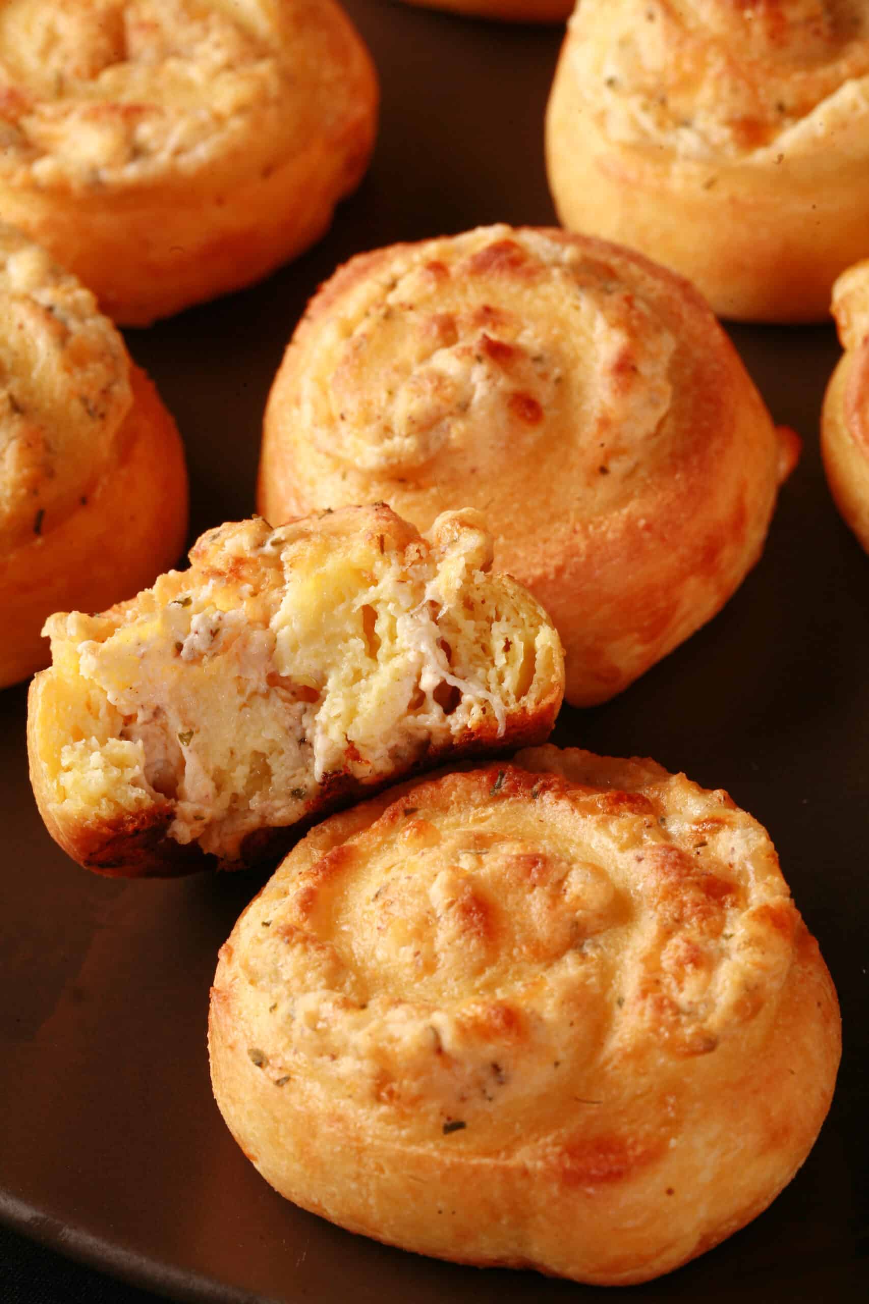 A plate of fathead pastry keto cheese and onion pinwheels.