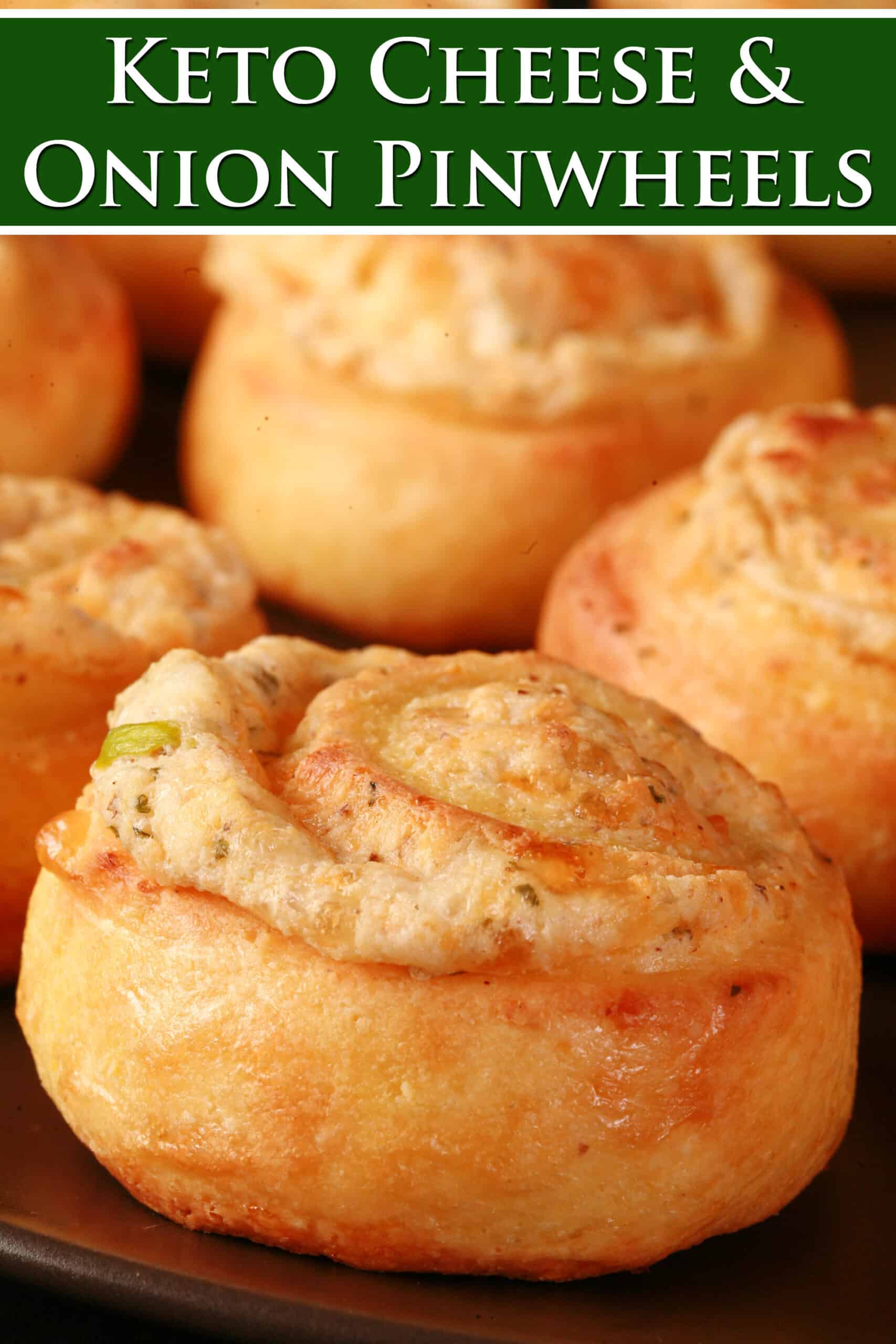 A plate of fathead pastry keto onion and cheese pinwheels. Overlaid text says keto cheese and onion pinwheels.