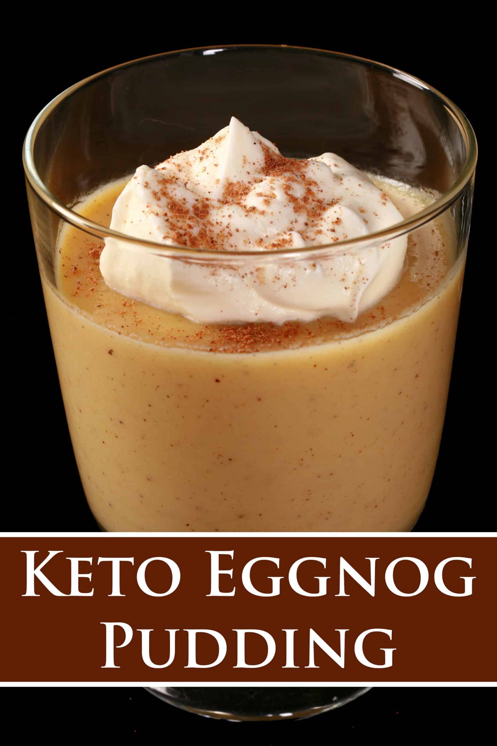 A glass of low carb eggnog pudding with whipped cream and nutmeg on top. Overlaid text says keto eggnog pudding.