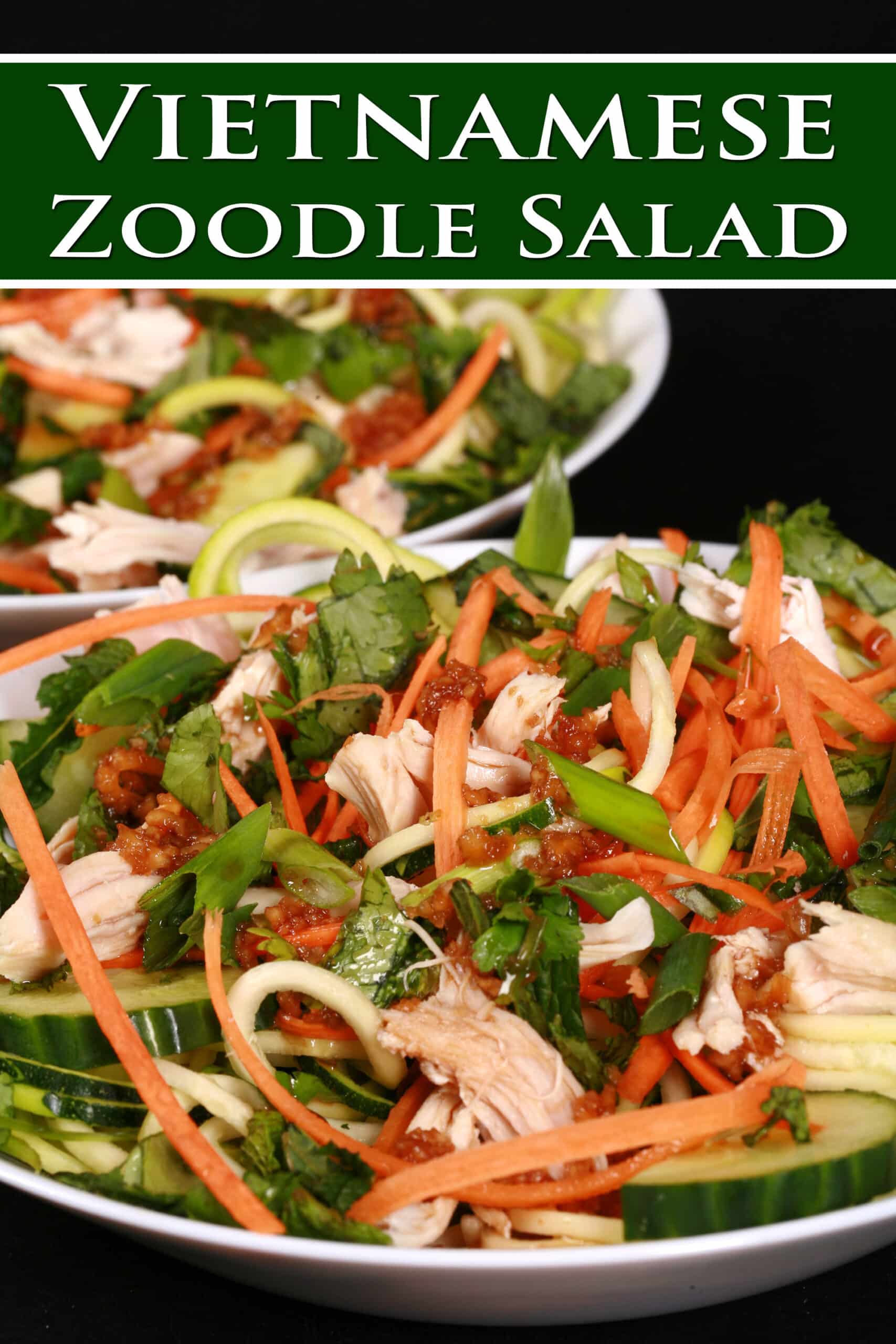 Two bowls of Vietnamese zucchini noodle salads, with zoodles, cucumber, carrot, mint, cilantro, chicken, and dressing. Overlaid text says Vietnamese Zoodle Salad.